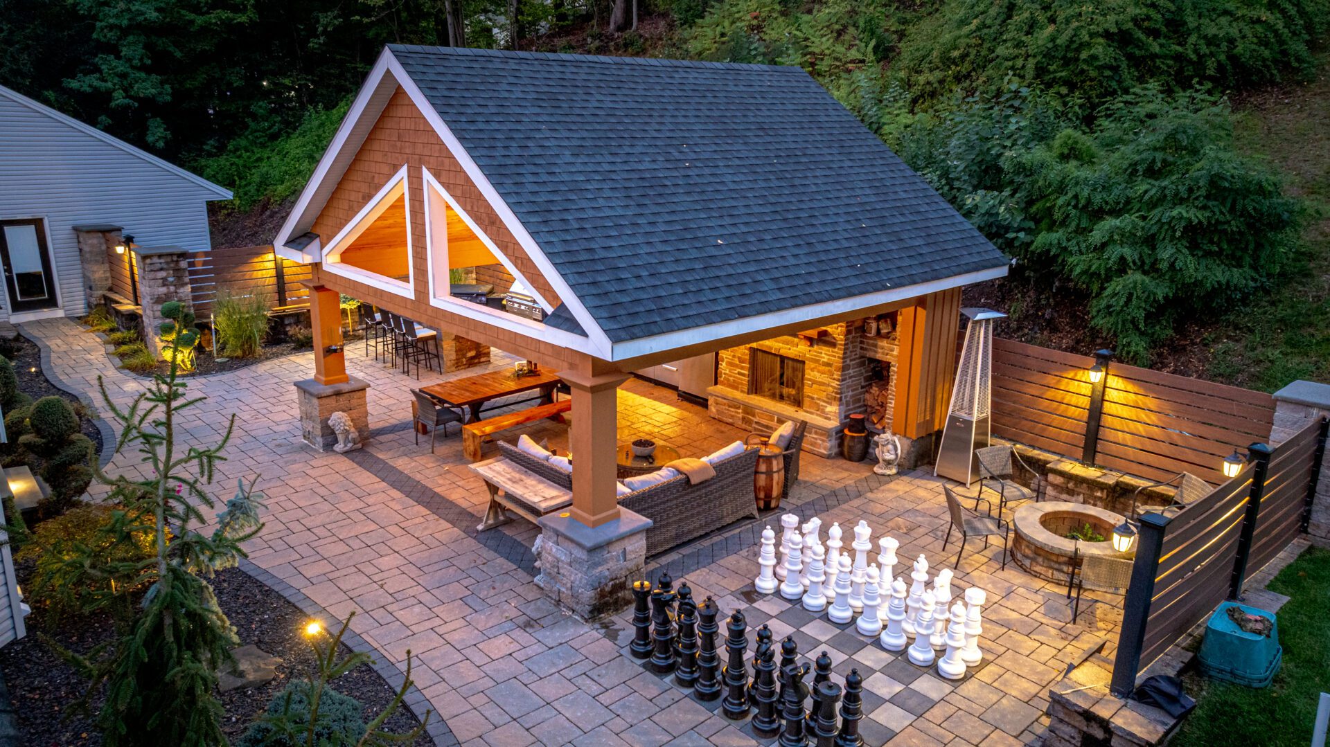 Hardscaping with covered patio, fire pit, and outdoor living space in Southington CT